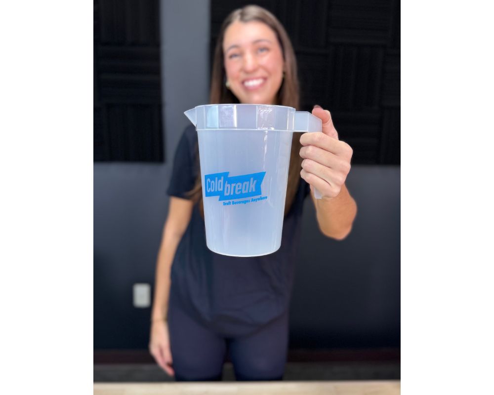 Person holding a clear plastic container with 'Coldbreak' branding.