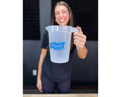 Person holding a clear plastic container with 'Coldbreak' branding.